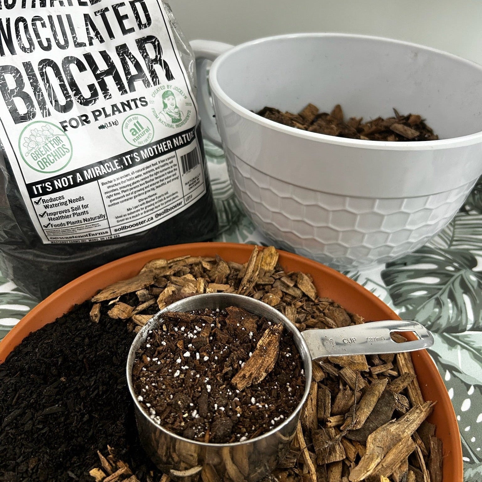 Biochar product with a measuring cup and bowl on a table